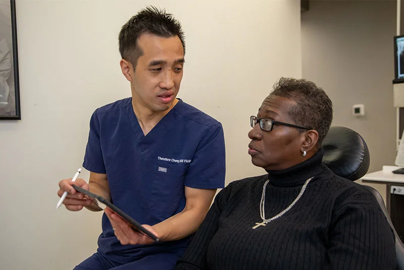 Dr. Chang reviewing a treatment plan with a patient